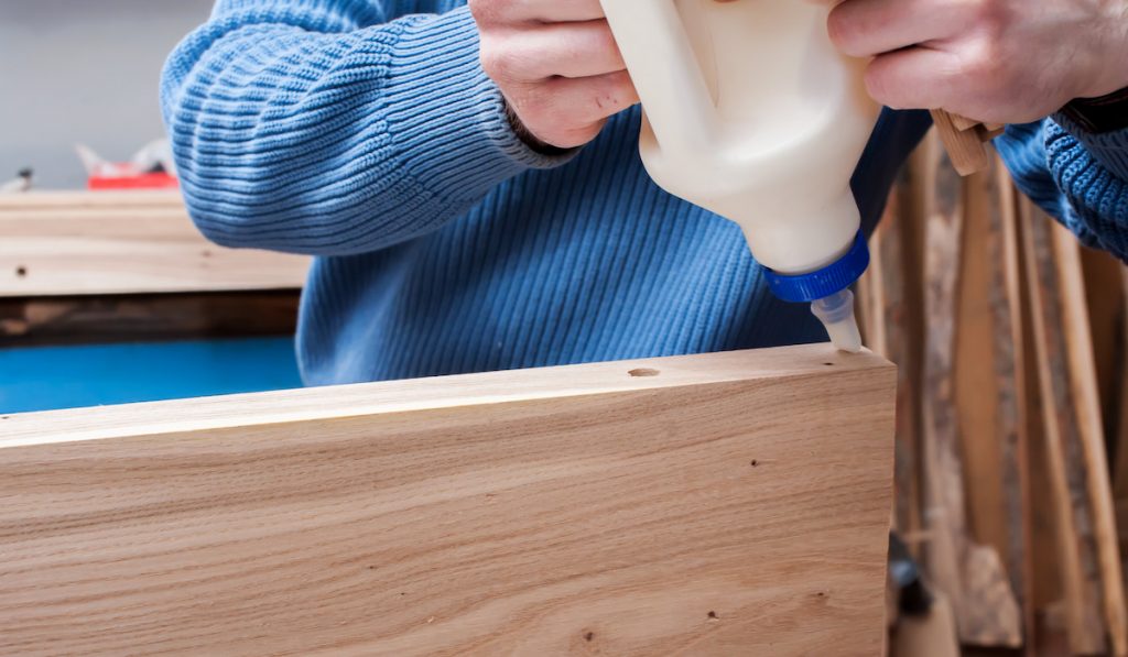 carpenter using heavy duty glue