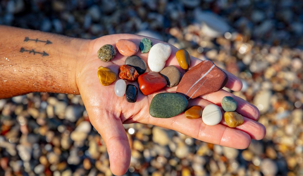 colorful pebbles on hand