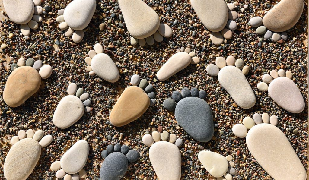 pebbles arranged to look like foot prints
